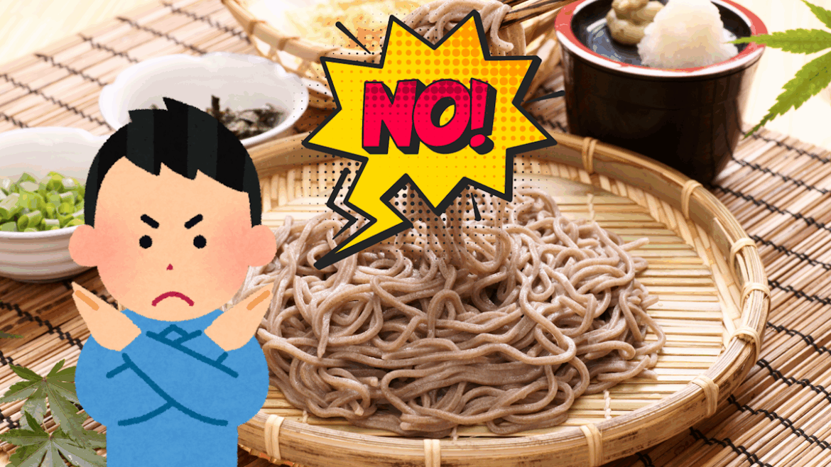 Picture of soba on a bamboo plate with an Irasutoya man in front of it crossing his arms and saying "no"