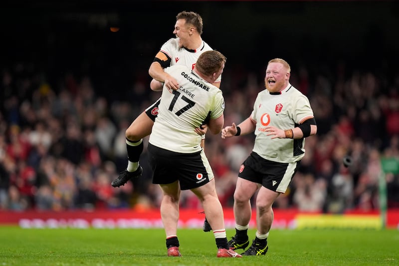 Jarrod Evans (top) celebrates Wales' victory against Japan at the Principality Stadium, Cardiff. Photograph: Andrew Matthews/PA Wire
