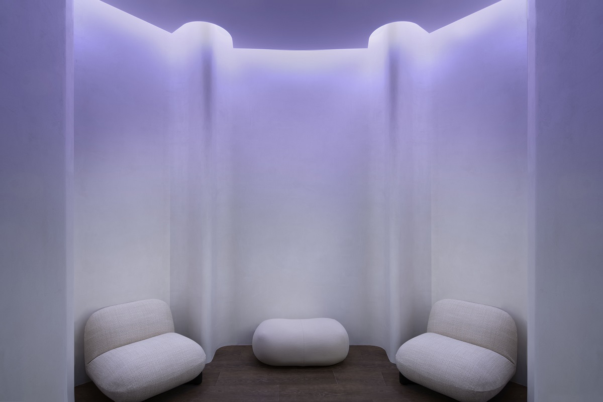 Serene Space mindfullness room with white cushions against white screens