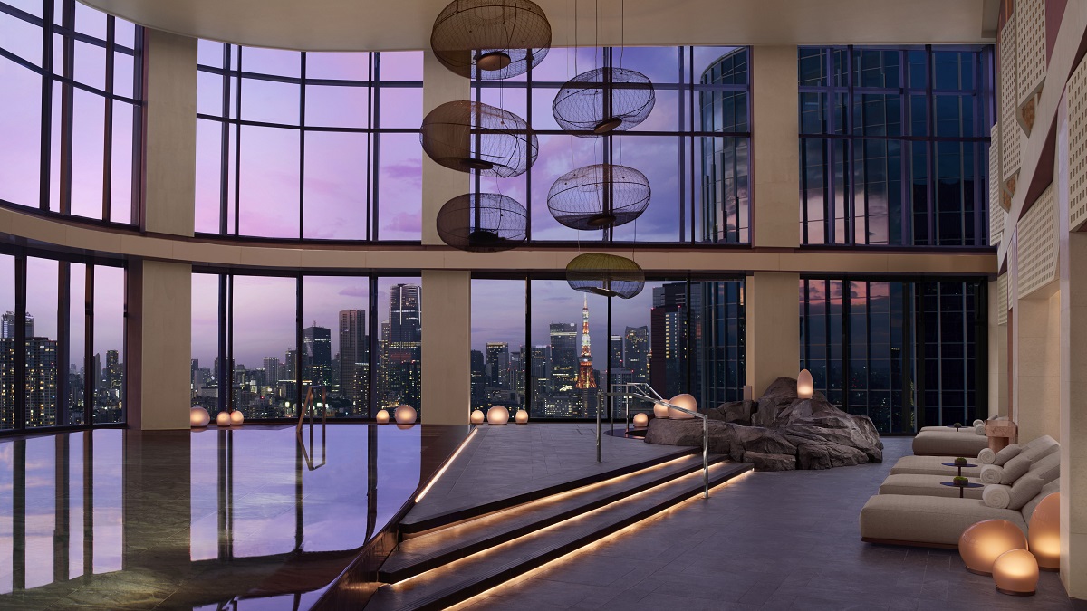 indoor swimming pool with evening view over tokyo