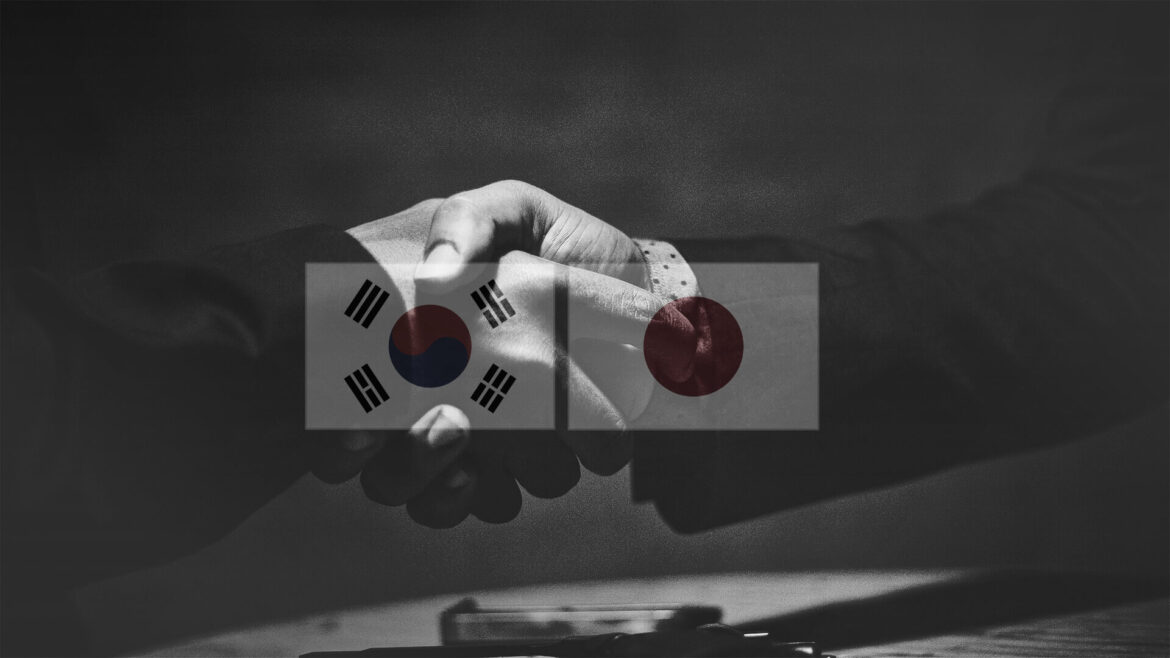 South Korean and Japanese Alliance? Hands shaking with South Korean and Japan flags over them