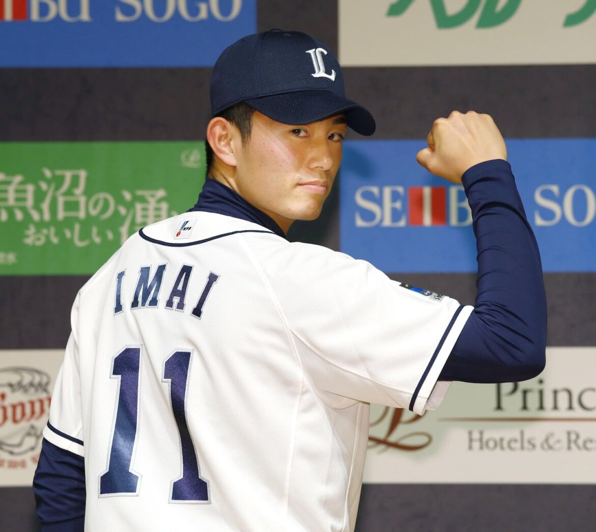Tatsuya Imai wears Seibu Lions' jersey during a news conference in Japan on Dec. 9, 2016.