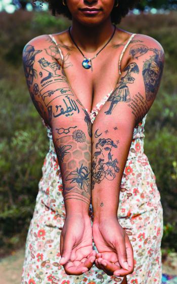 Erica Lockuff showing her tattoos.