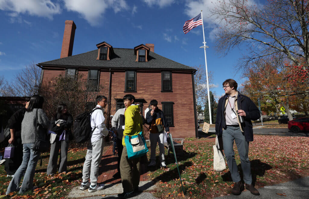 Jack McCarthy, right, the coordinator of international relations for the town of Nanae, Japan, leads his student delegration after a visit to the Wright Tavern on Tuesday, October 28, 2025. Ken McGagh/The Concord Bridge