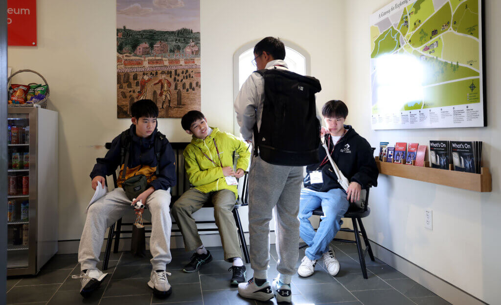 Nanae students (from left) Daiki Iriyama, Outa Kitamura and Hinata Nihonyanagi relax during a visit to the Concord Museum on Tuesday, October 28, 2025. Ken McGagh/The Concord Bridge