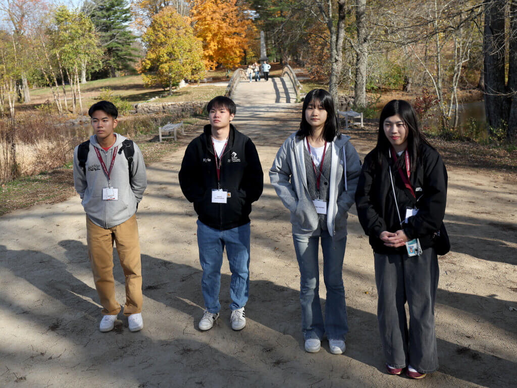 Nanae students (from leftt) Soa Waki, Hinata Nihonyanagi, Ryoka Koishi and Kiyoka Ogawa listen to tour guide Joe Palumbo during a visit to North Bridge on Tuesday, October 28, 2025. Ken McGagh/The Concord Bridge