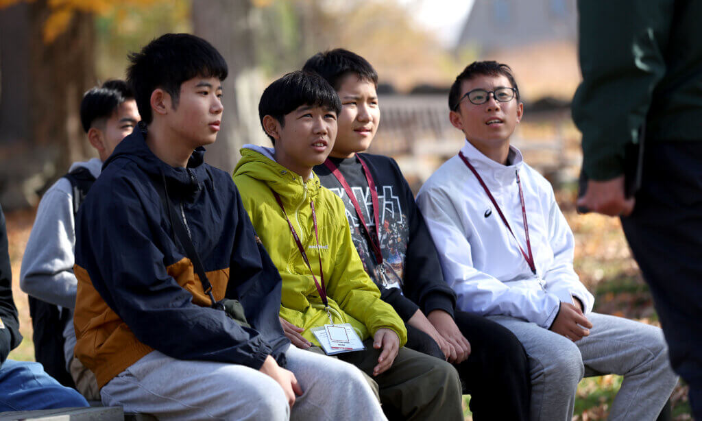 Nanae students (from left) Daaiki Iriyama, Outa Kitamura, Shogo Kimura and Joshin Kugita listen to tour guide Joe Palumbo at Nortrh Bridge on Tuesday, October 28, 2025. Ken McGagh/The Concord Bridge