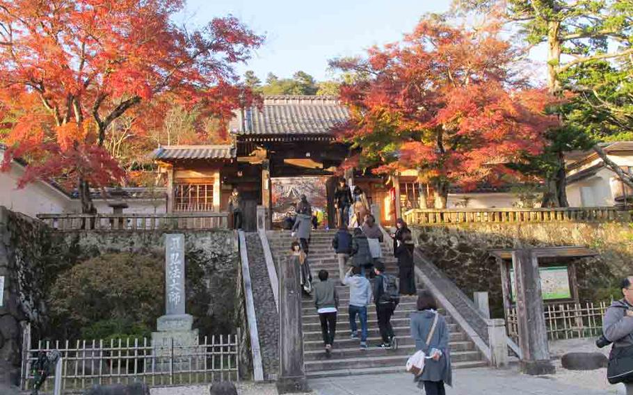 Visitors climb up the stairs to Shuzenji.