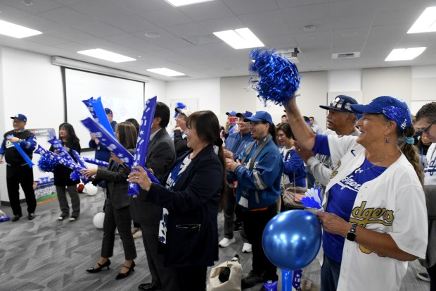 Attendees cheer during the city of Torrance “International Dodgers Celebration,”...