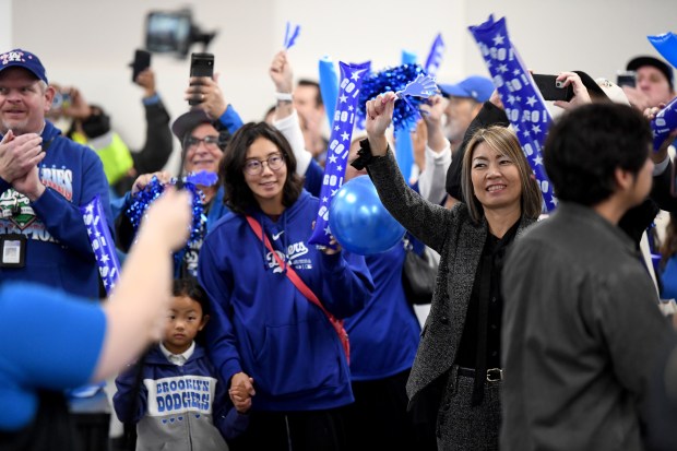 Attendees cheer during the city of Torrance “International Dodgers Celebration,”...
