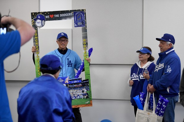 Mayor George Chen takes pictures during “International Dodgers Celebration,” with...