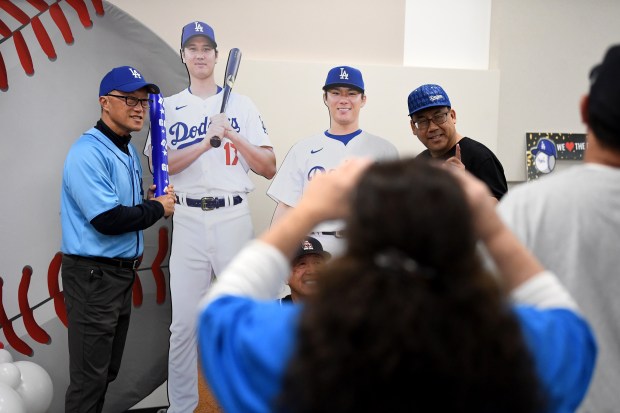 Mayor George Chen takes pictures during “International Dodgers Celebration,” with...