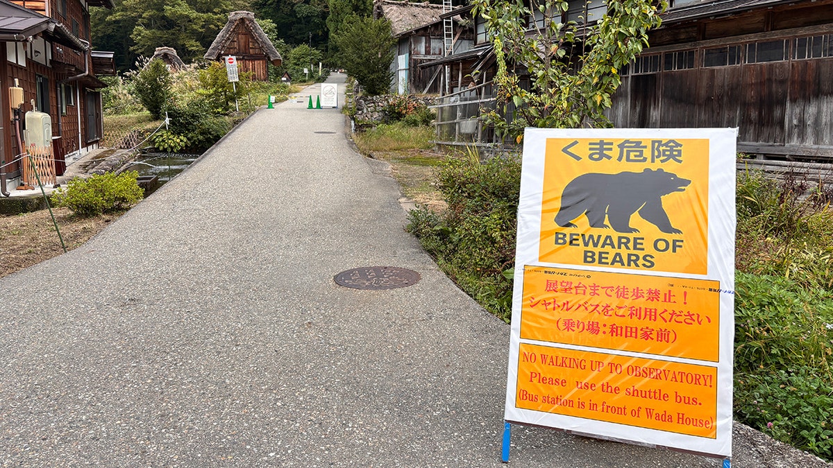 A sign warning tourists and locals to beware of bears in Japan.