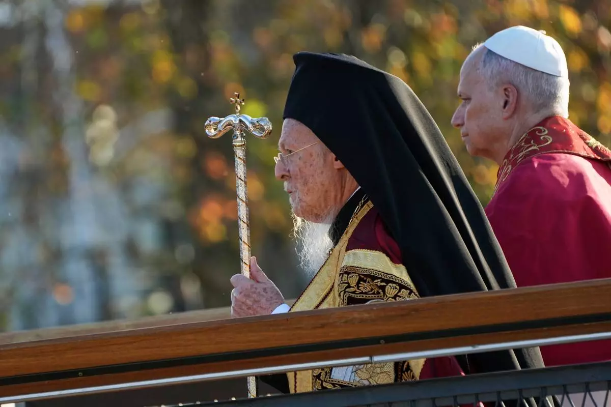 Pope Leo XIV and the Ecumenical Patriarch Bartholomew I, left, lead an Ecumenical prayer service near the archaeological excavations of the ancient Basilica of Saint Neophytos, in Iznik, Turkey, Friday, Nov. 28, 2025. (AP Photo/Domenico Stinellis)