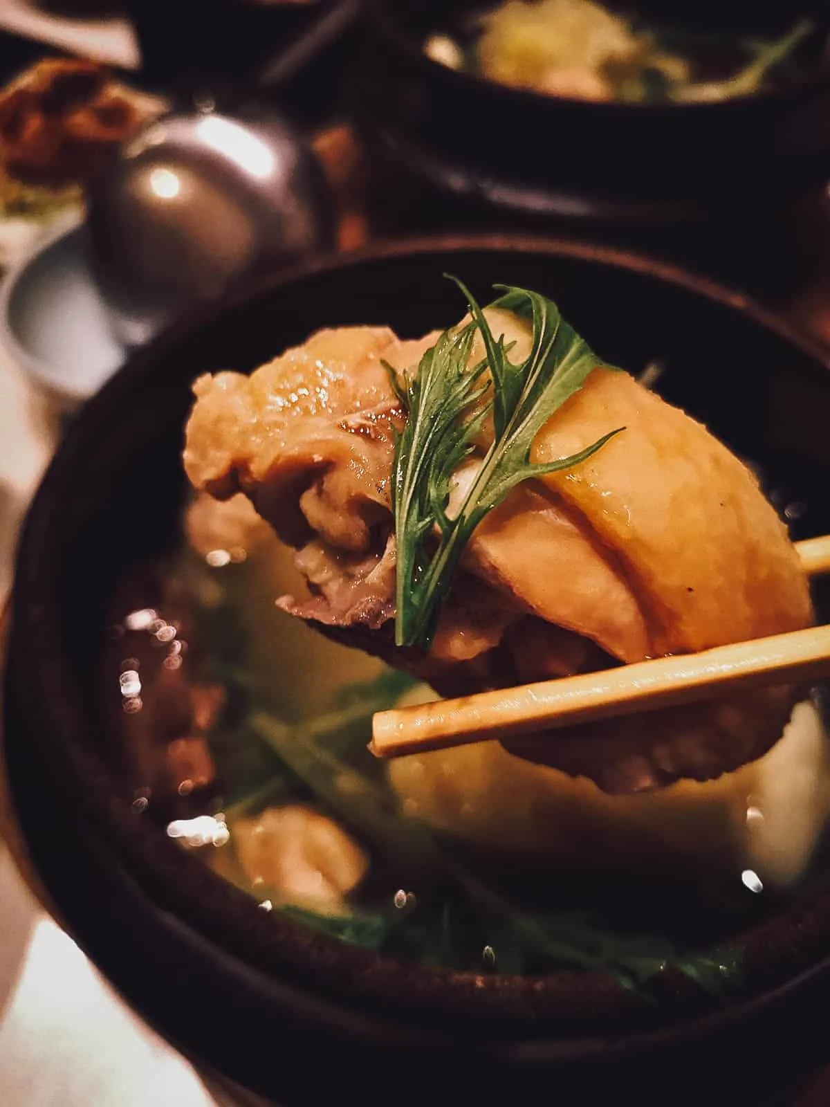 The Best Fukuoka Food and Restaurants Piece of chicken from mizutaki in Fukuoka