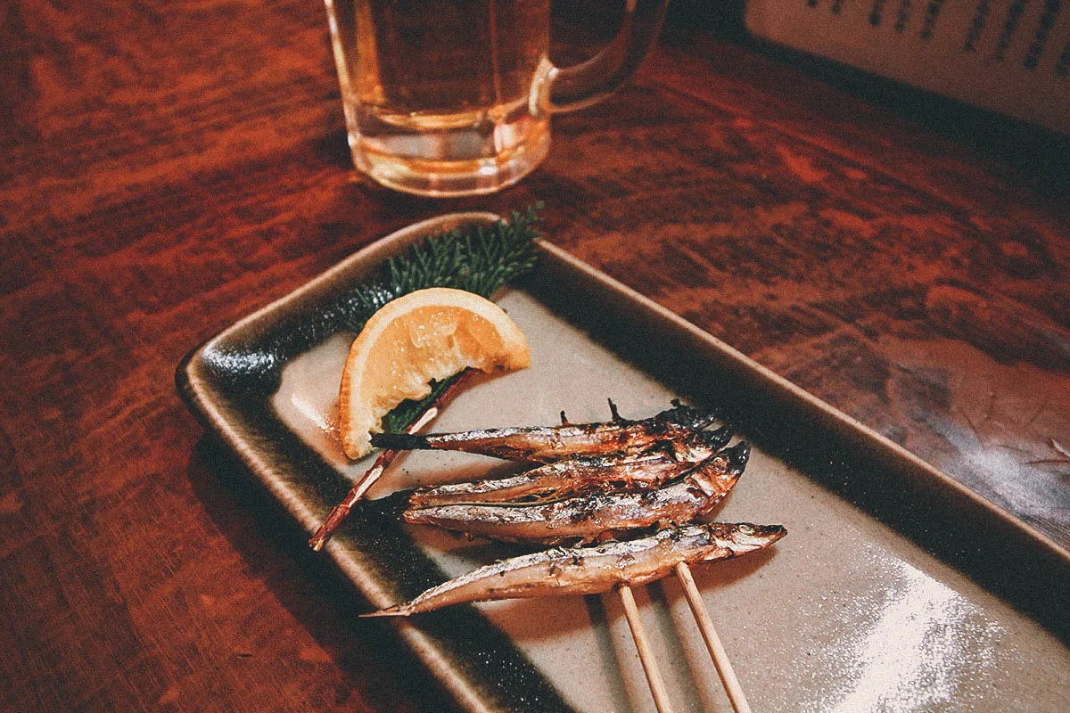 The Best Fukuoka Food and Restaurants Skewered fish inside a yatai stall in Fukuoka