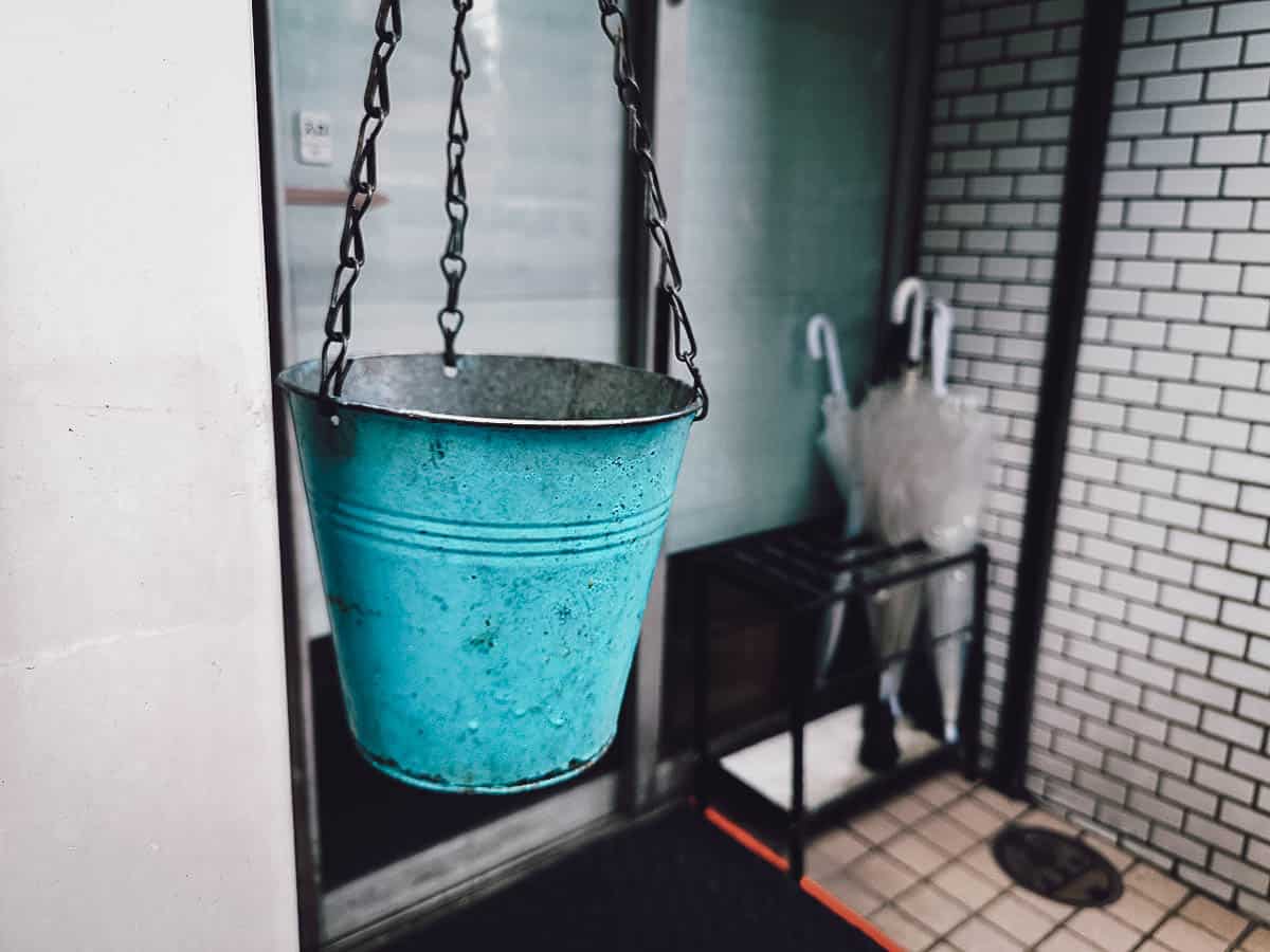 The Best Fukuoka Food and Restaurants Blue bucket hanging outside Hakata Genki Ippai exterior in Fukuoka