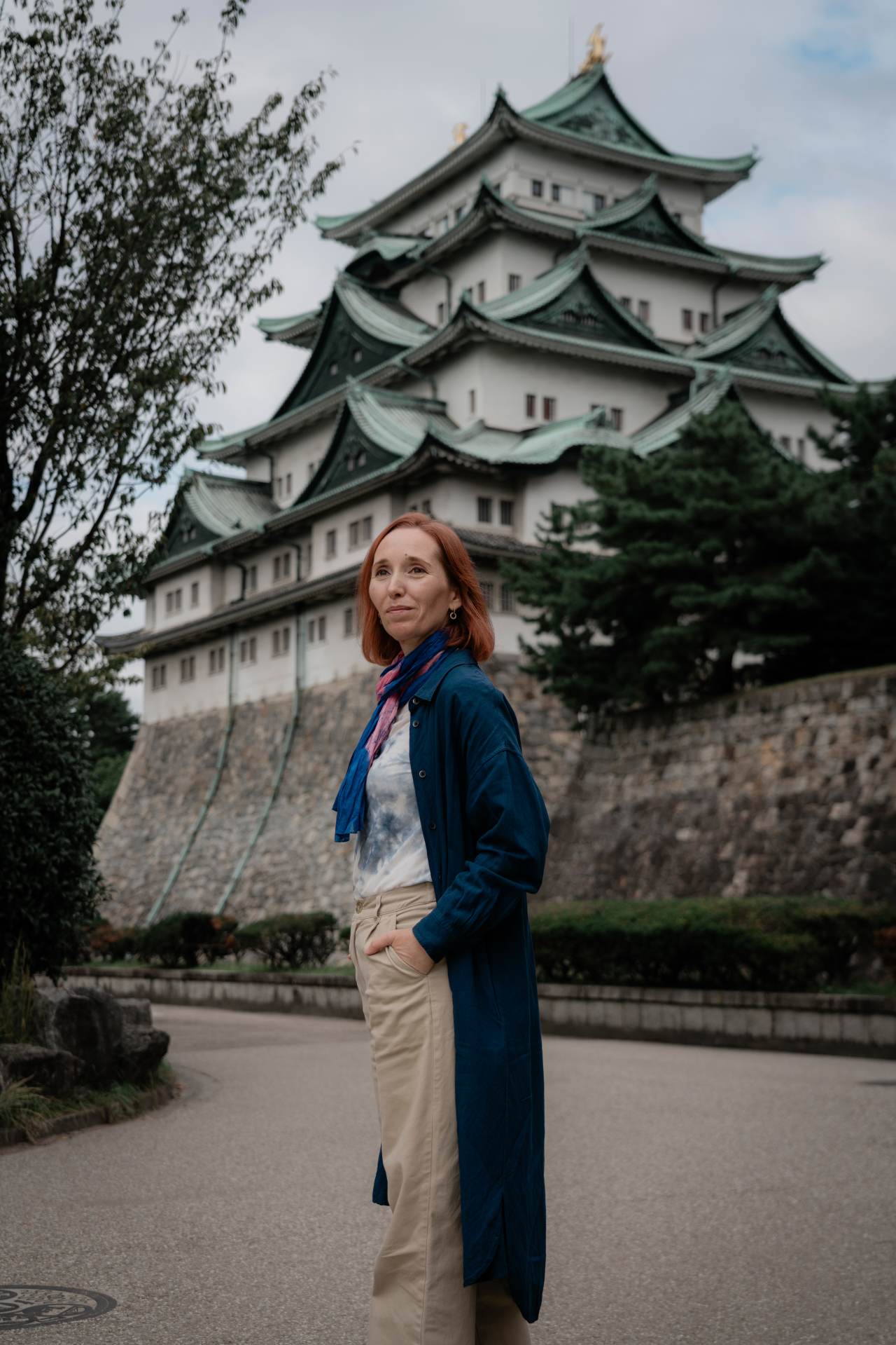Tour guide Elisabeth Llopis poses in front of Nagoya Castle.
