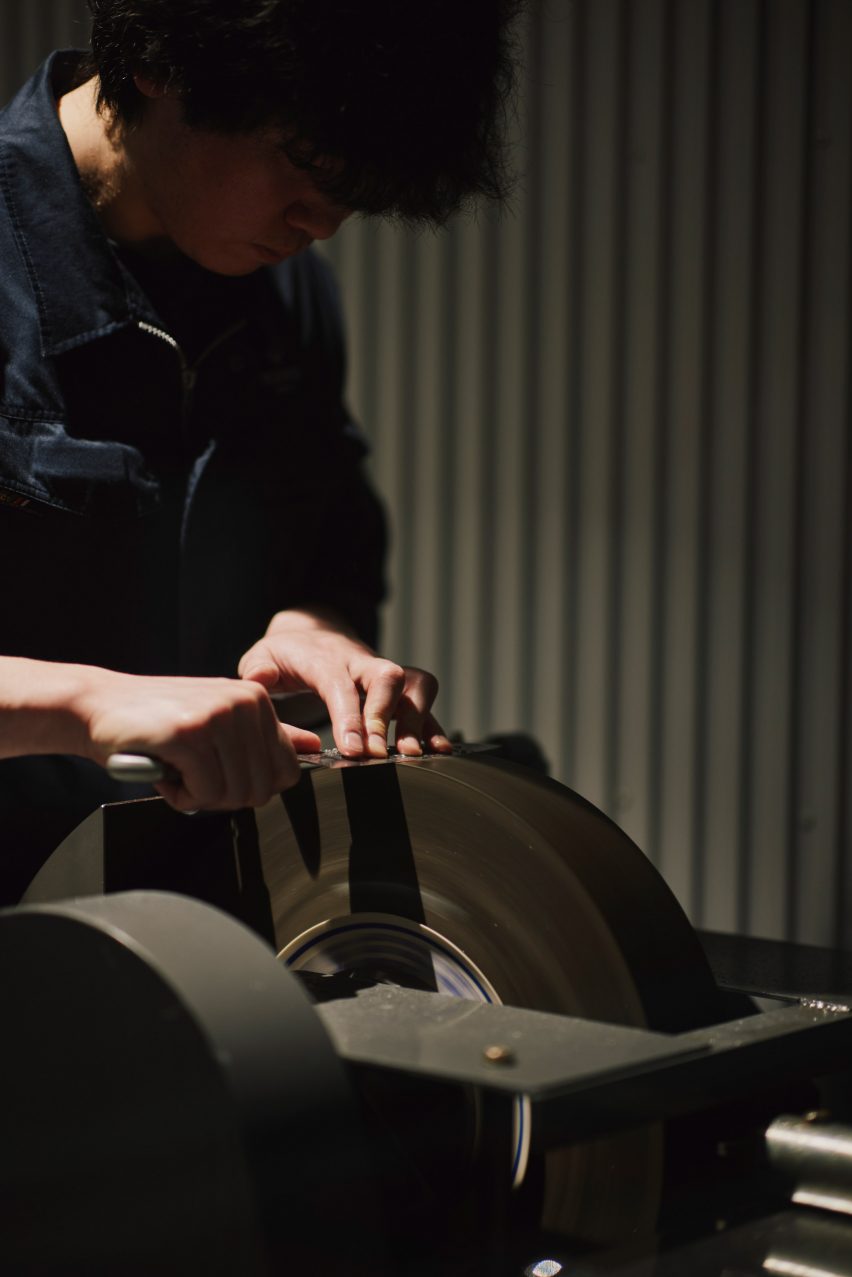 Person sharpening a knife
