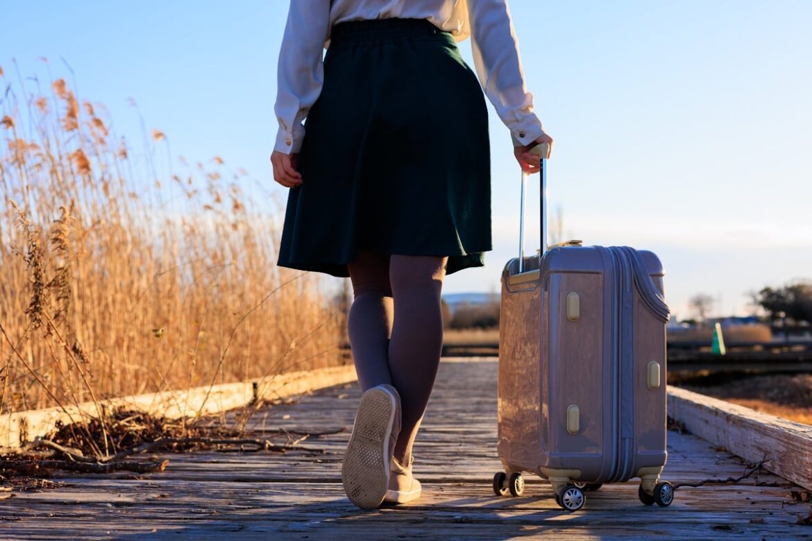 Vacation Guilt: Why Japanese Workers (Still) Can’t Rest Woman walking down street with roller suitcase
