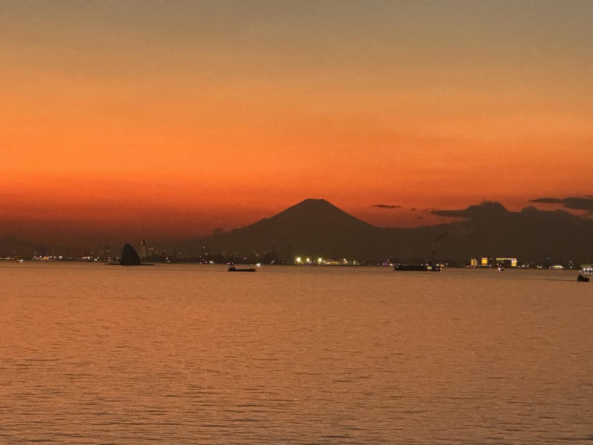 Mt. Fuji at dusk, with coastal traffic settling into the Yokohama–Tokyo approach.