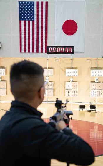 A JROTC cadet from Matthew C. Perry High School sets his sights before firing from the standing position during the Pacific East Regional Marksmanship Match at Marine Corps Air Station Iwakuni, Japan, Dec. 5, 2025.
