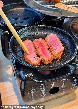 The crumbed beef dish, known for its crispy panko crust, is typically served medium rare, but customers can sear the meat to their liking using the sizzling hot stone provided in front of them