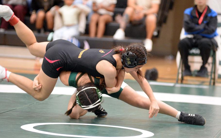 Jasmin Davis and Sena Vought wrestle.