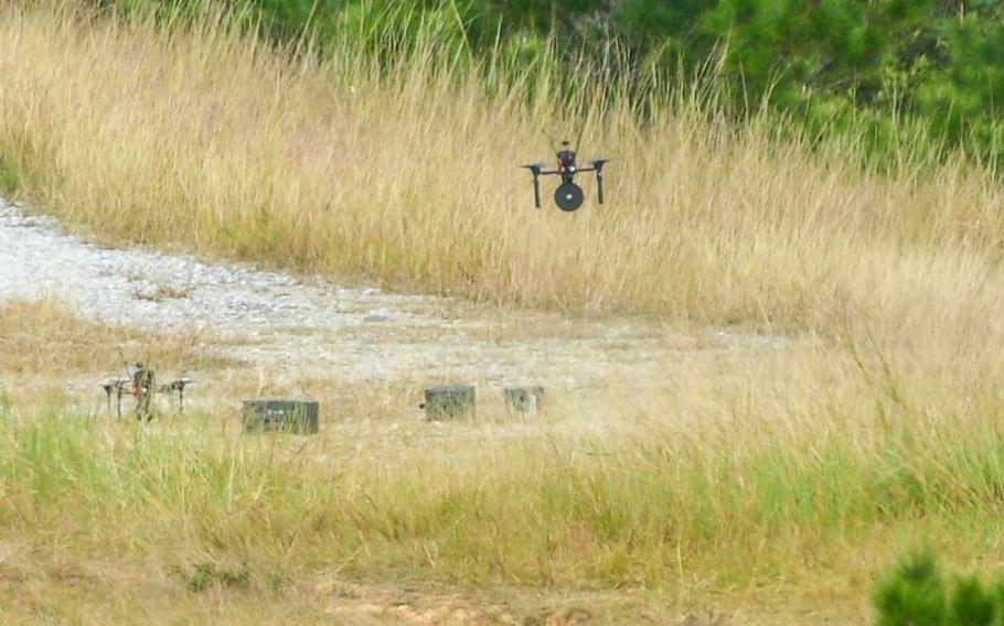 Marines launch attack drones to strike a training target during a competition on Camp Schwab, Okinawa, Dec. 11, 2025.