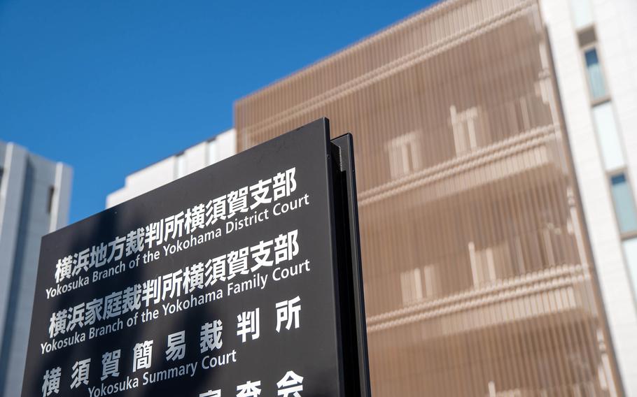 A building with a sign in front.