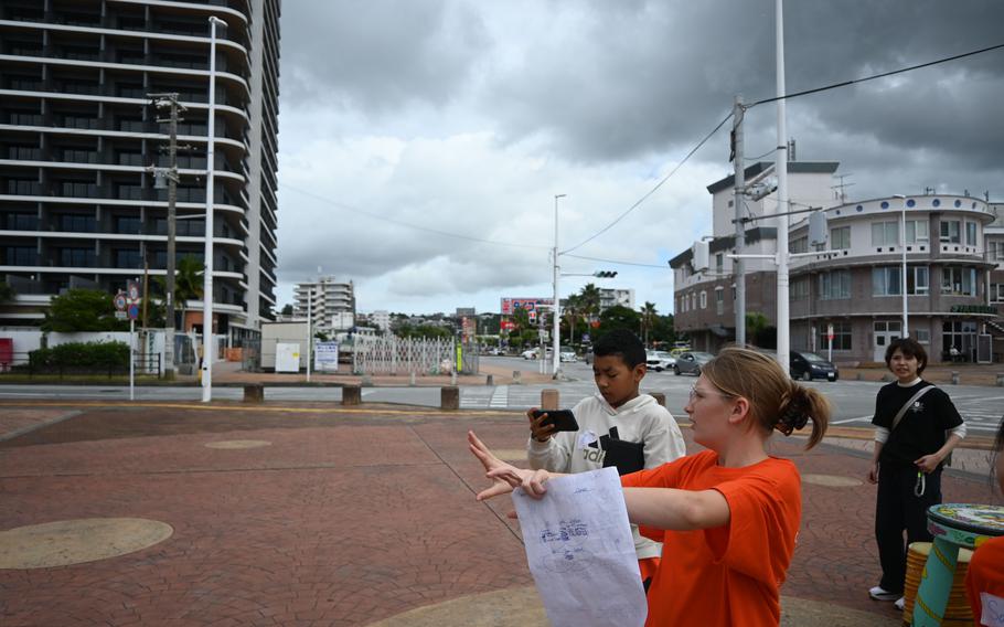 Middle school students look at an outdoor space.
