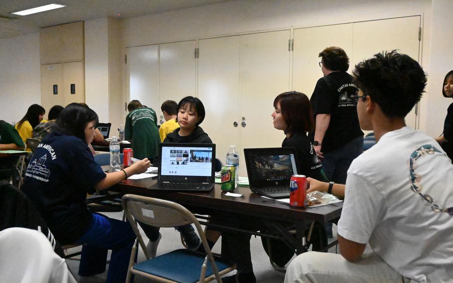 American and Japanese middle school students work on video content.