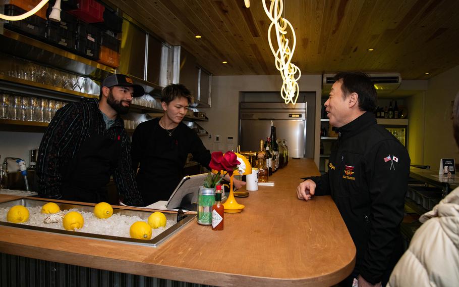 A Japanese mayor visiting a local business.