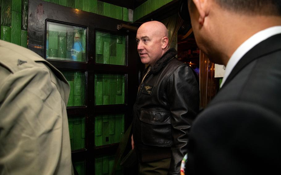 Col. Kenneth Rossman exiting a building.