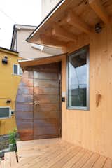 In Tokyo, Curved Copper Volumes and Hinoki Wood Boxes Build This Home Up, Not Out - Photo 6 of 15 - 