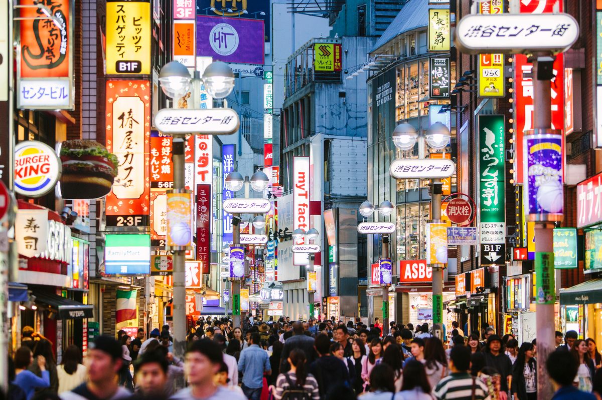 People walking in Shibuya  shopping district.