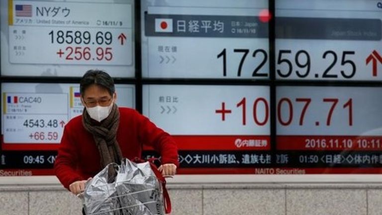 Japanese Stocks Erase Early Gains as Revised GDP Shows Deeper Contraction