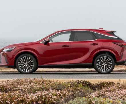 Side profile shot of a red 2025 Lexus RX 350h Premium AWD