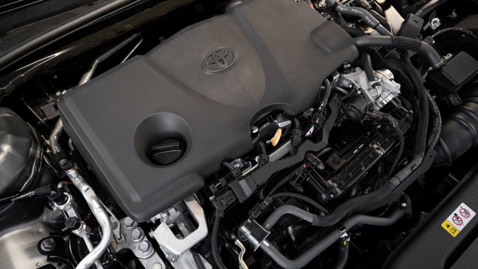 Close-up shot of the engine under the hood of a 2026 Toyota Camry XSE.