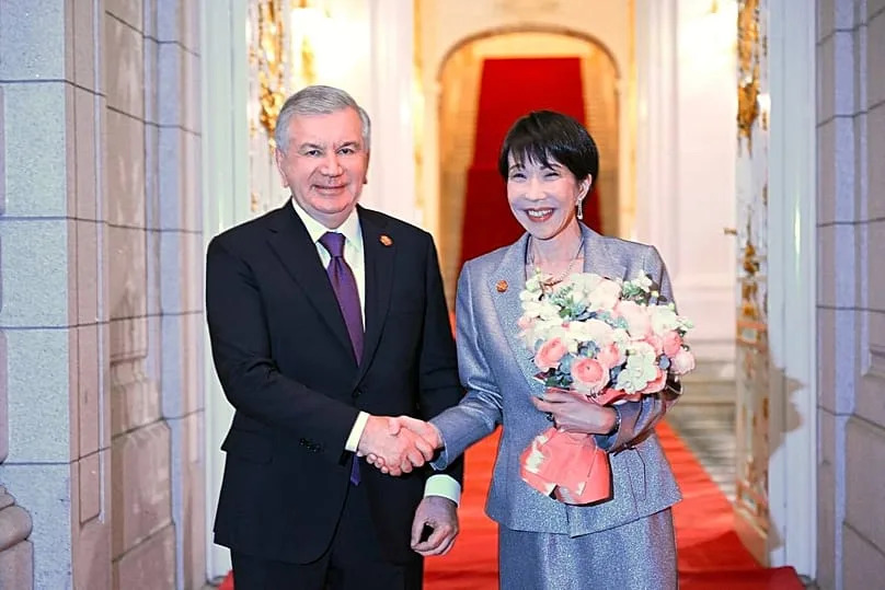 Uzbekistan's President Shavkat Mirziyoyev is welcomed by Japan's PM, Sanae Takaichi