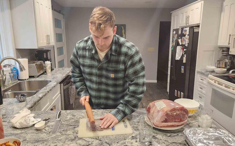 the author’s husband preparing for the holiday meal