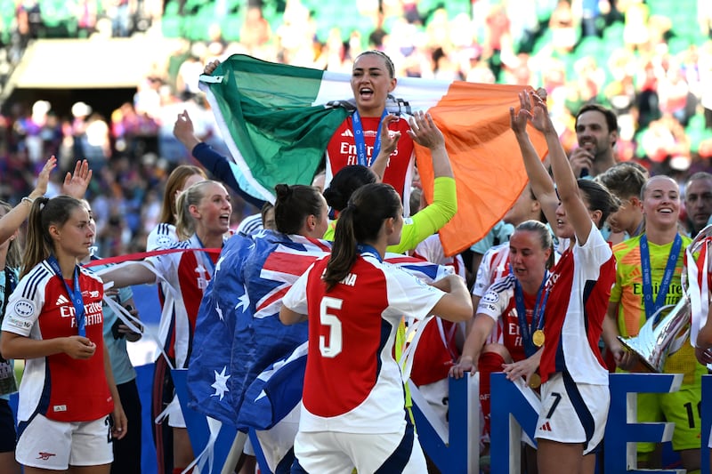 Arsenal's Katie McCabe, top, and team-mates celebrate winning the Champions League in Lisbon in May. Photograph: Zed Jameson/PA