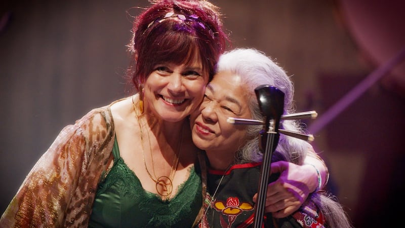 Cathy Jordan from Dervish and Okinawan singer Misako Koja embrace after their stunning version of The Mountains of Pomeroy