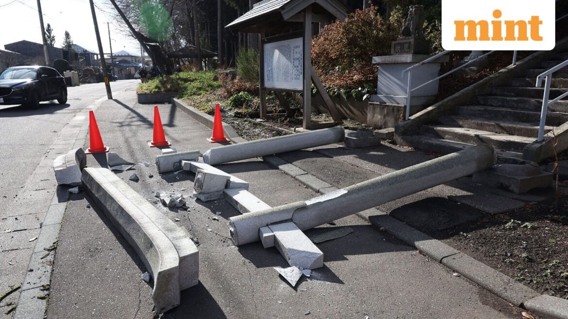 A torii gate at the entrance of Yasaka Shrine is seen after it collapsed onto a sidewalk in Hachinohe City in Aomori Prefecture on December 9, 2025, following a 7.5 magnitude earthquake off northern Japan.