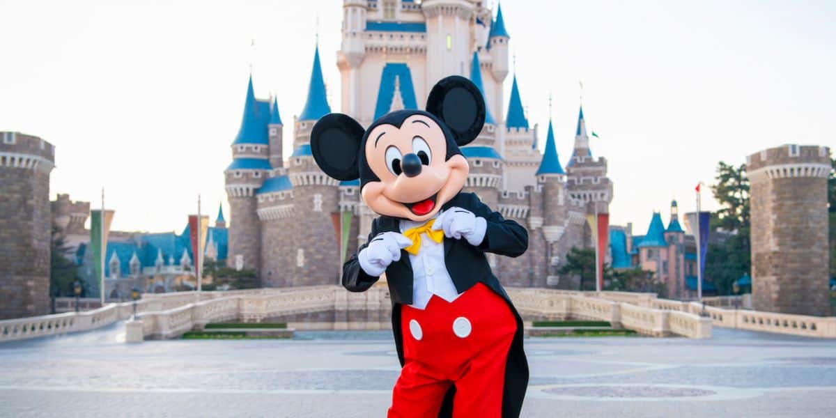 Mickey Mouse in front of Tokyo Disney Resort Park's Cinderella Castle