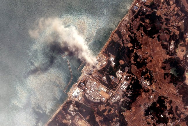 FUTABA, JAPAN - MARCH 14: In this satellite view, the Fukushima Dai-ichi Nuclear Power plant after a massive earthquake and subsequent tsunami on March 14, 2011 in Futaba, Japan. Japanese officials report that a fire at the stricken Fukushima nuclear power plant has released radioactive material into the air in the latest development in the chaos wrought by the recent earthquake and tsunami that have left at least 10,000 people dead in northeastern Japan. (Photo by DigitalGlobe via Getty Images via Getty Images)