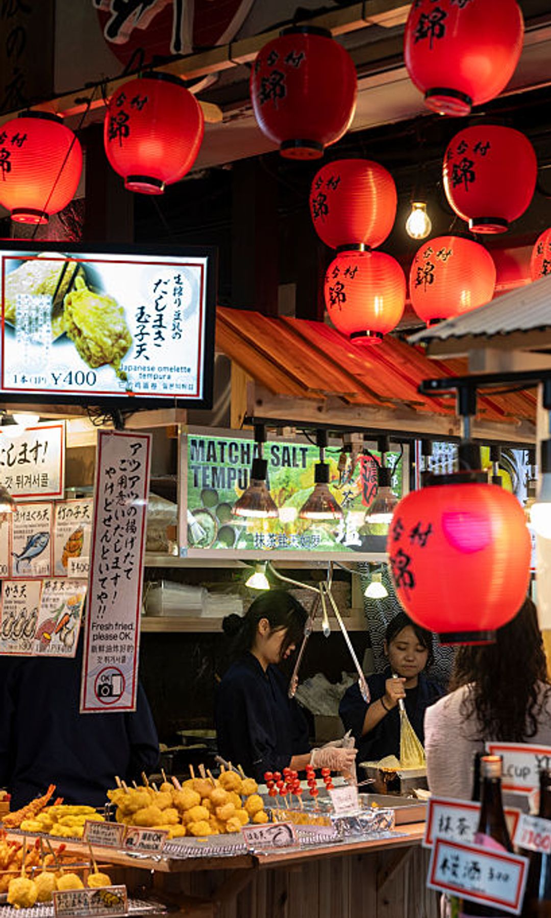 Cooks run a tempura restaurant at Nishiki Market on July 205 2025 in Kyoto, Japan