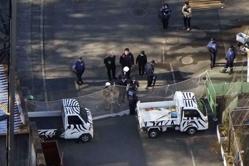 Police gather at Tama Zoological Park in Tokyo on Sunday after a wolf escaped from its enclosure. (Photo: Kyodo)