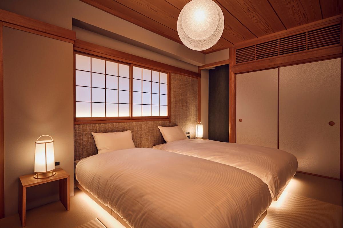 Image may contain Indoors Interior Design Home Decor Cushion Furniture Bed Bedroom and Room