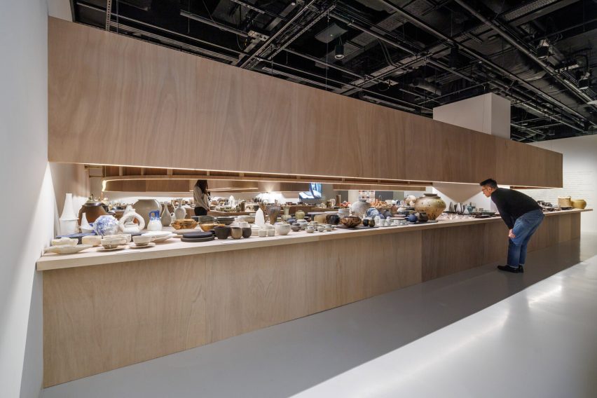 Man looking at craft at Japan House London